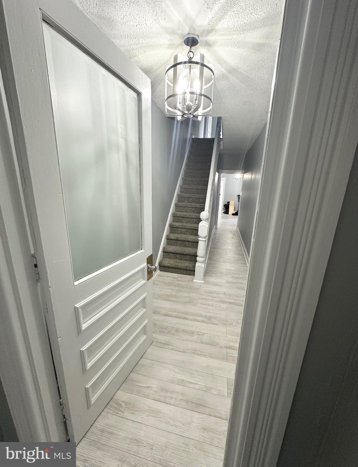 331 Tyler Street Trenton, NJ 08609 - Photo 5 of 49 a view of entryway and hall with wooden floor