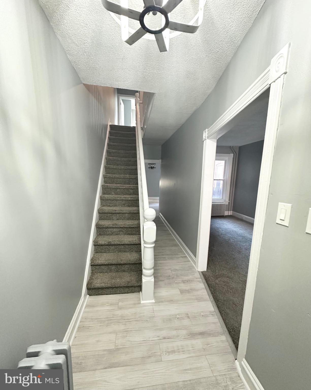 331 Tyler Street Trenton, NJ 08609 - Photo 7 of 49 a view of entryway and hall with wooden floor