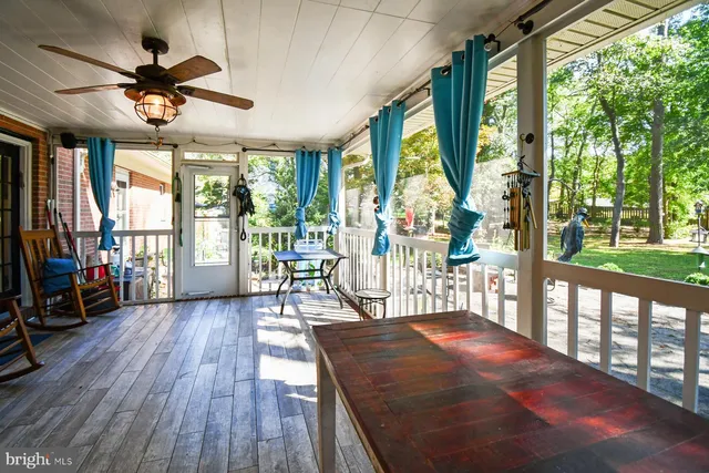 a backyard of a house with outdoor seating