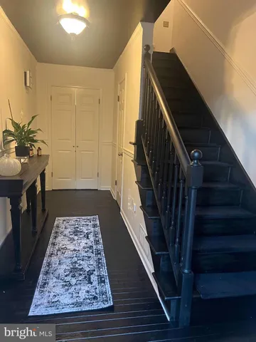 a view of entryway with wooden floor