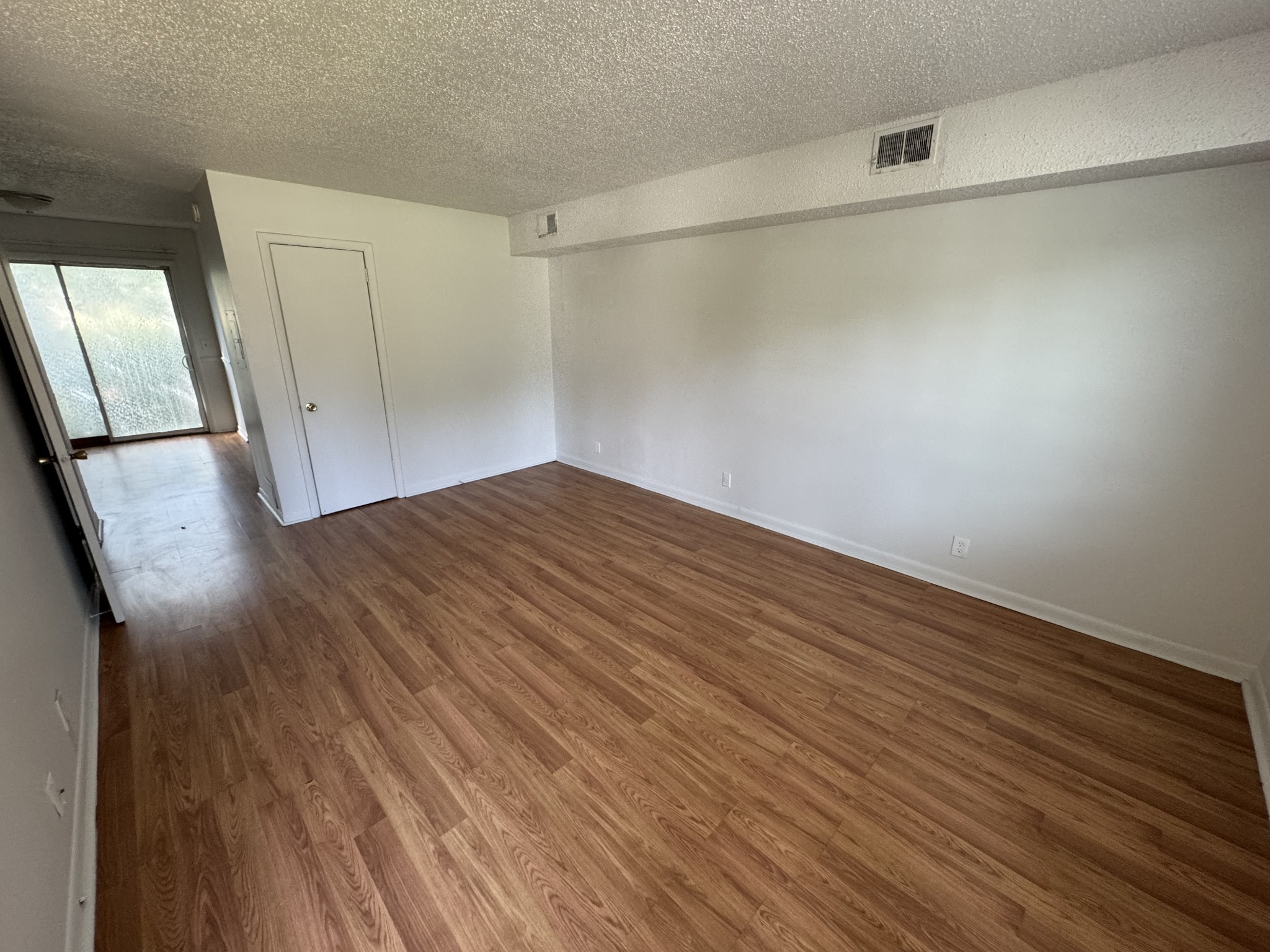 441 Harding Place, Unit C1 Nashville, TN 37211 - Photo 2 of 6 a view of empty room with wooden floor and fan
