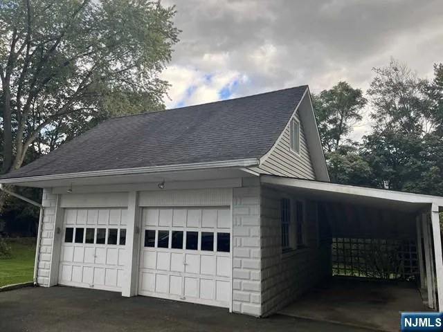 a view of a white house with a large window