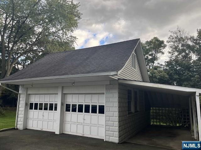 300 Harristown Road, Unit 1 Glen Rock, NJ 07452 - Photo 20 of 20 a view of a white house with a large window