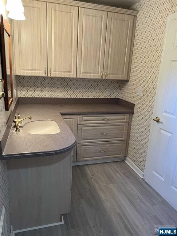 300 Harristown Road, Unit 1 Glen Rock, NJ 07452 - Photo 9 of 20 a bathroom with a sink and a mirror