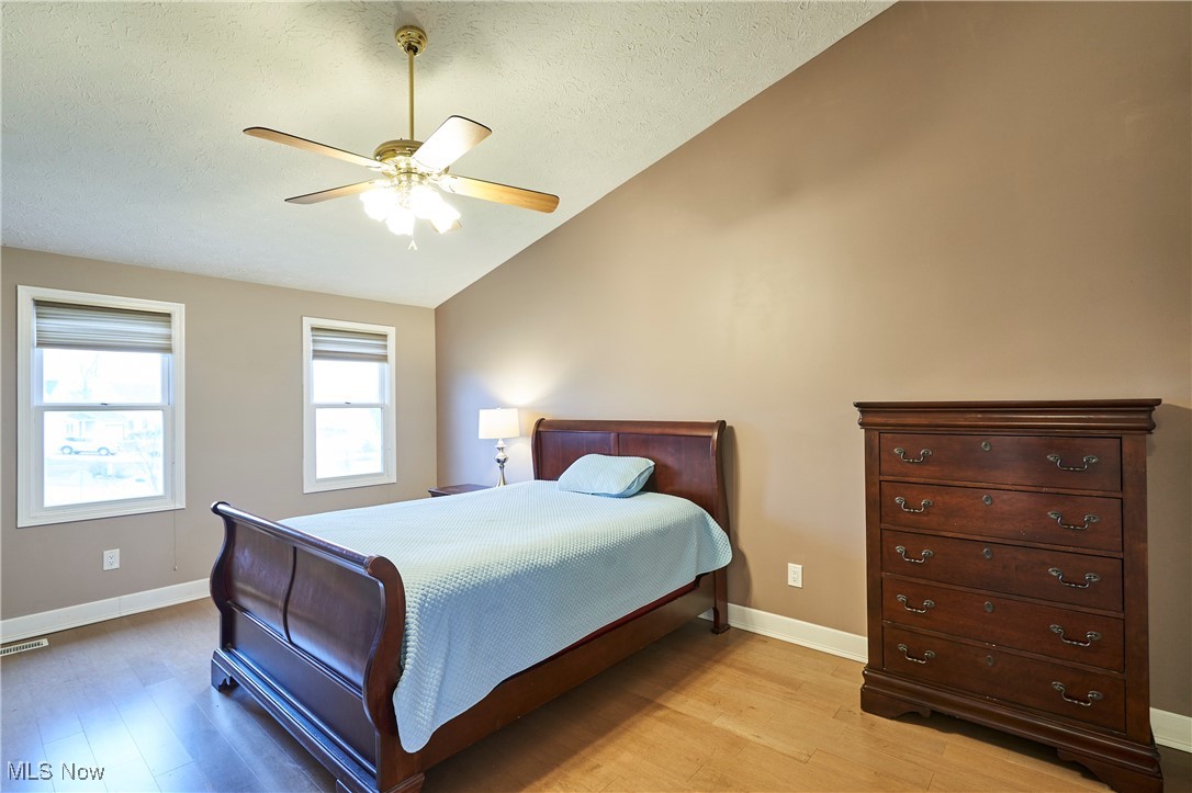 637 Redfield Lane Akron, OH 44321 - Photo 16 of 31 The second floor master bedroom has vaulted ceilings and updated LVT flooring