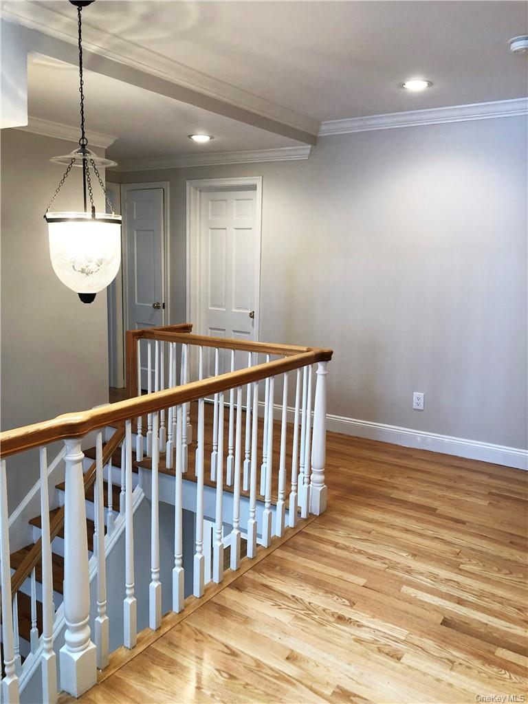 49 Commodore Road Chappaqua, NY 10514 - Photo 17 of 26 a view of hallway with windows