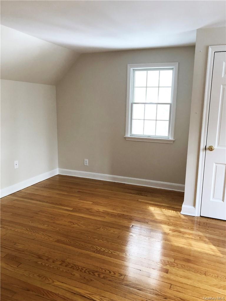 49 Commodore Road Chappaqua, NY 10514 - Photo 21 of 26 a view of a room with wooden floor and window