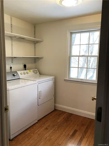 a view of a balcony with chairs