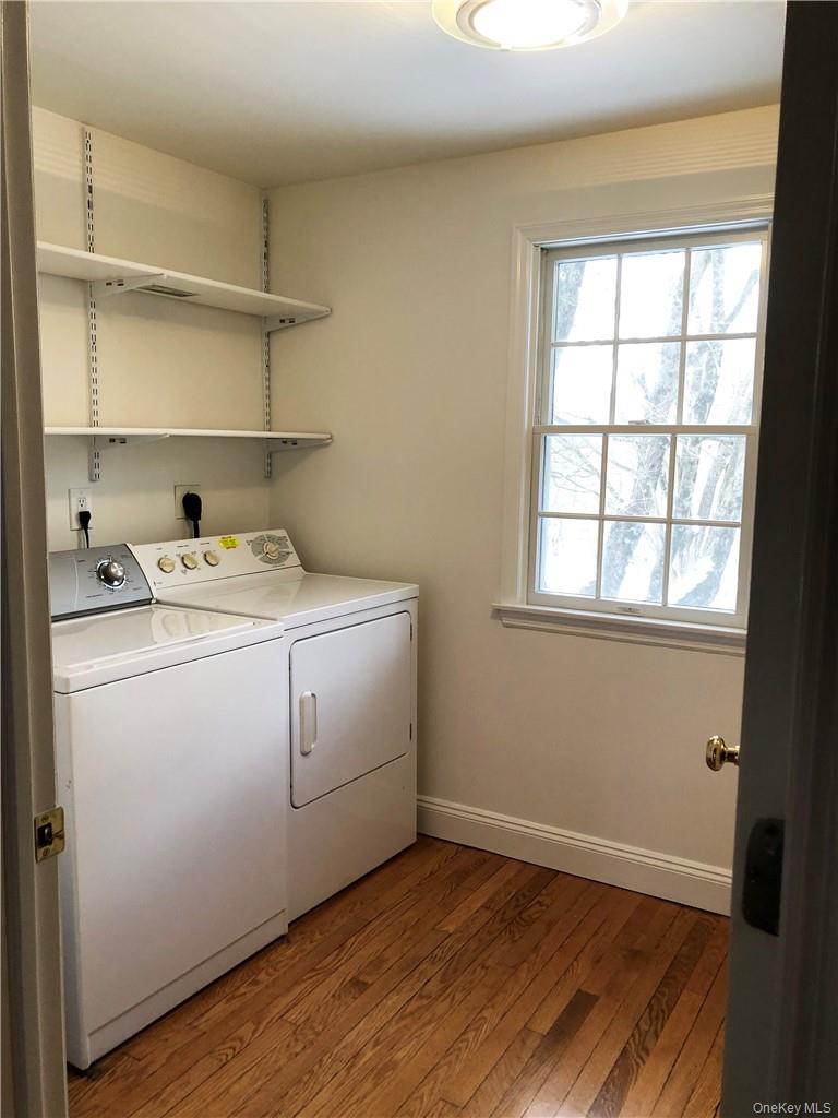 49 Commodore Road Chappaqua, NY 10514 - Photo 22 of 26 a storage room with wooden floor washer and dryer