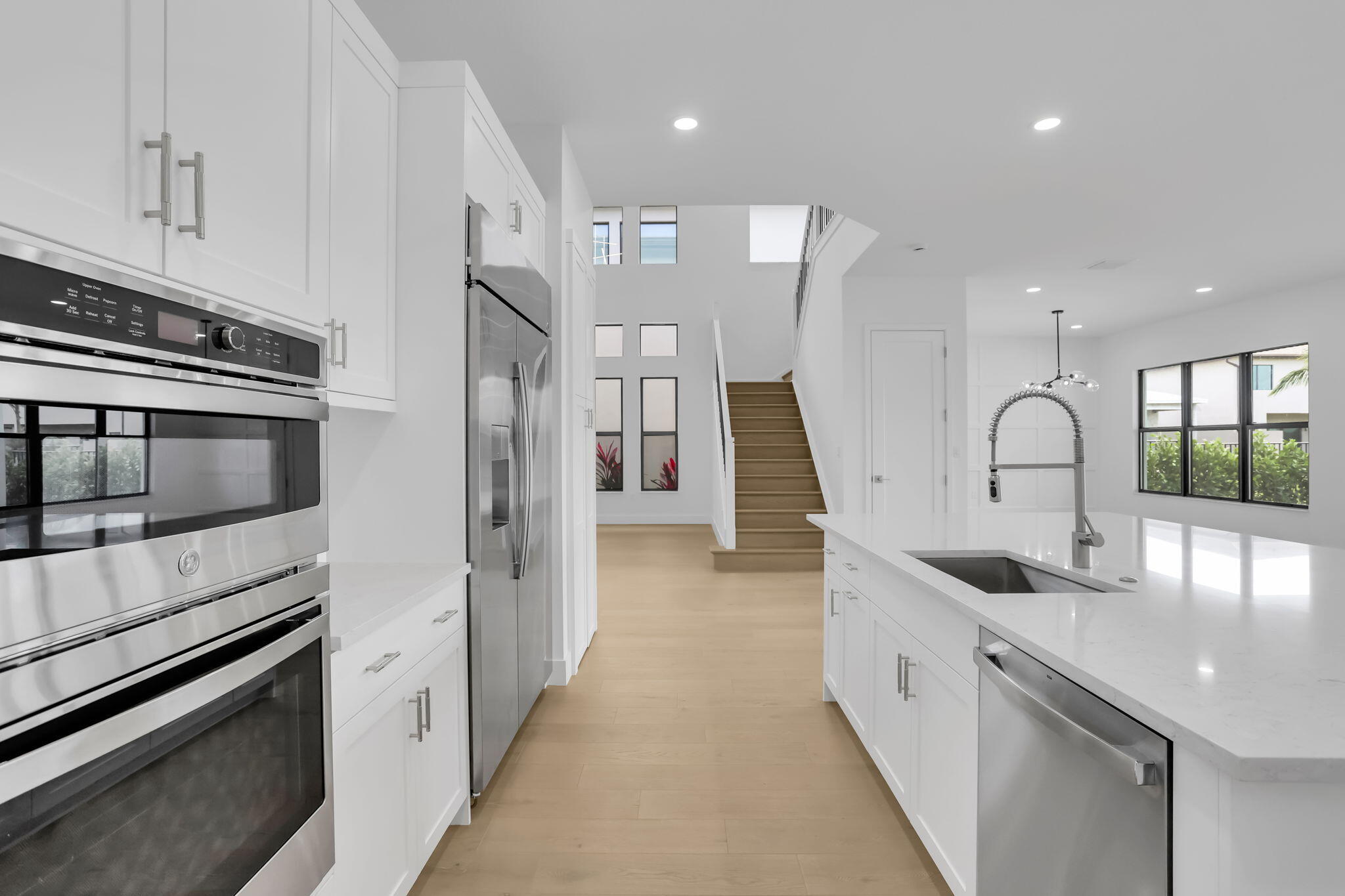21049 Violet Flds Way Boca Raton, FL 33434 - Photo 14 of 54 a kitchen with stainless steel appliances granite countertop a sink and a stove