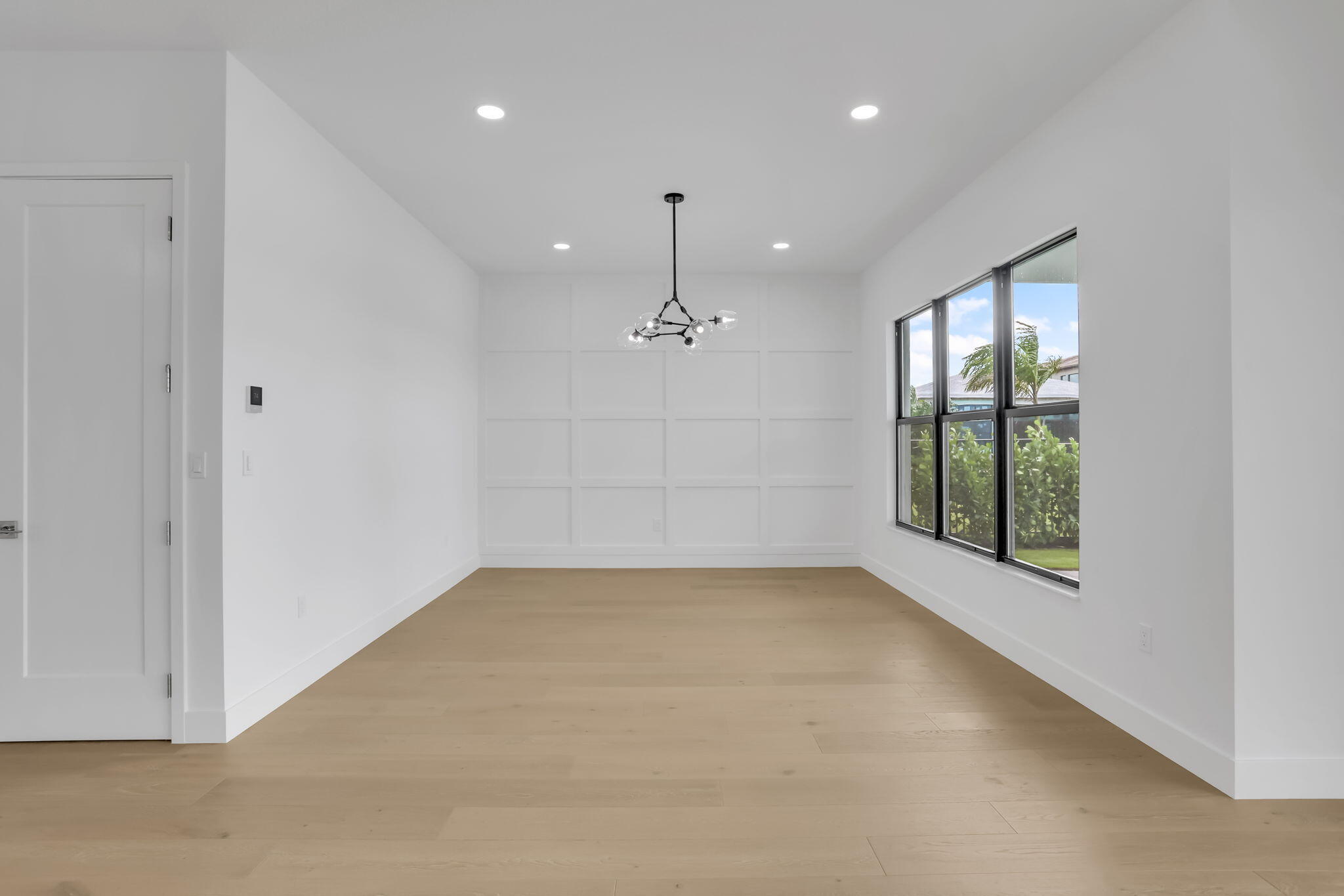 21049 Violet Flds Way Boca Raton, FL 33434 - Photo 17 of 54 an empty room with windows and chandelier fan