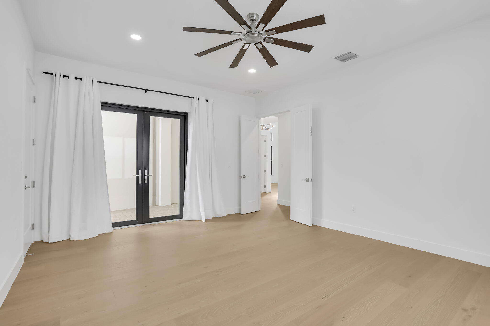21049 Violet Flds Way Boca Raton, FL 33434 - Photo 18 of 54 a view of a livingroom with a ceiling fan and window