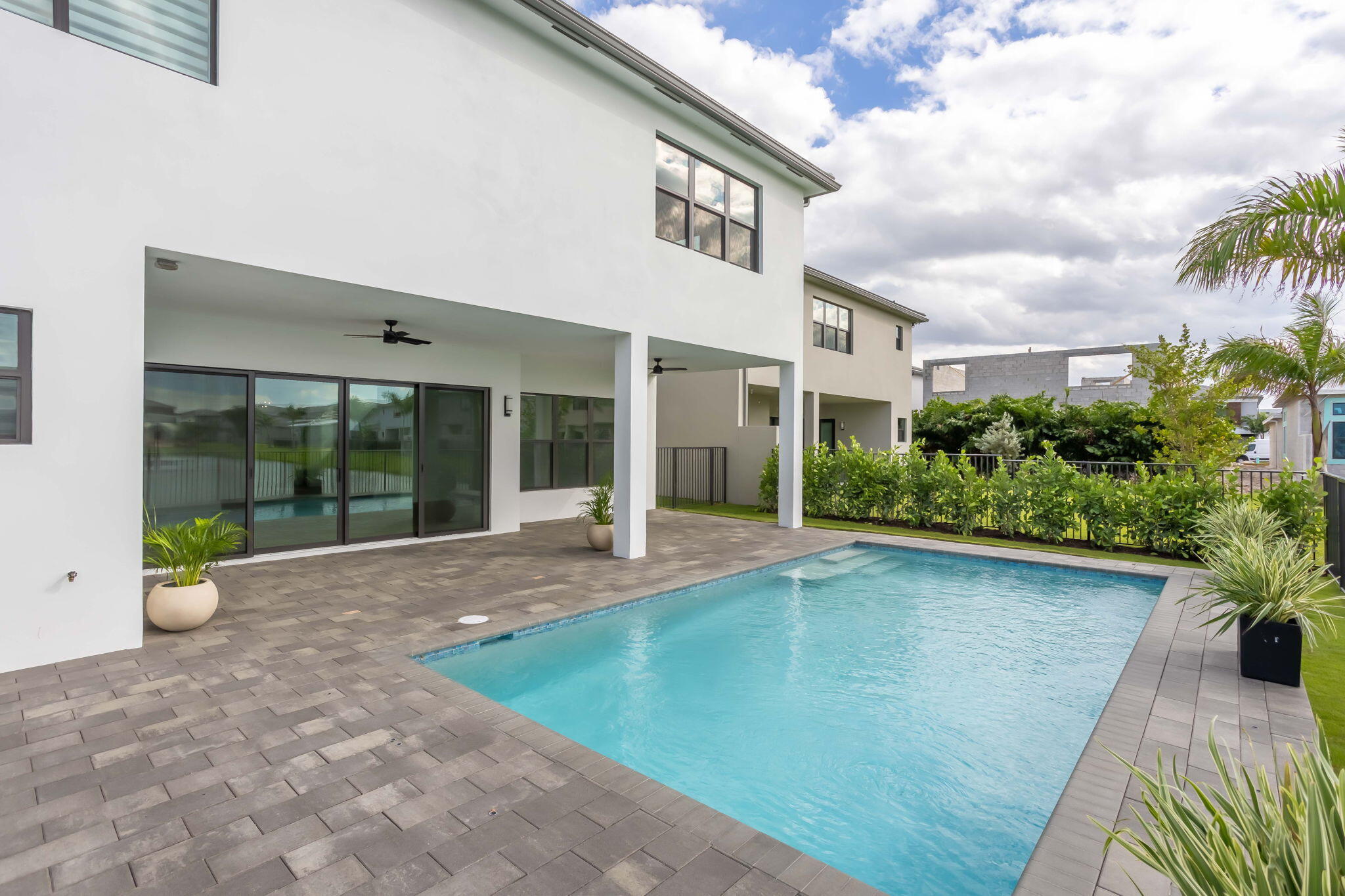 21049 Violet Flds Way Boca Raton, FL 33434 - Photo 23 of 54 a view of a house with backyard and sitting area