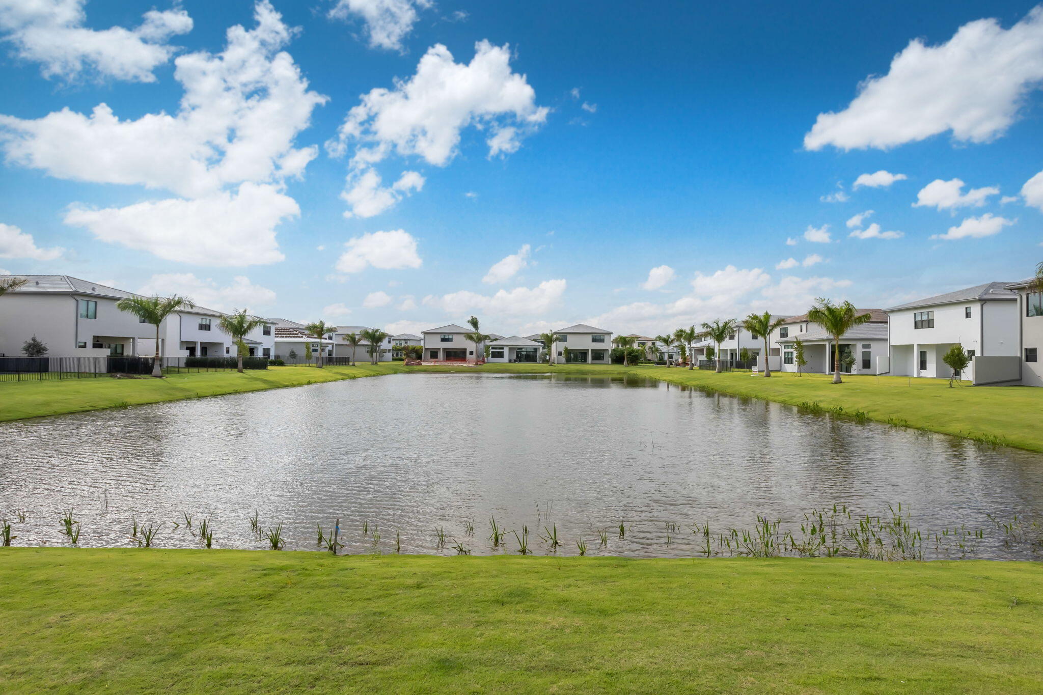 21049 Violet Flds Way Boca Raton, FL 33434 - Photo 26 of 54 a view of a lake with houses in the background