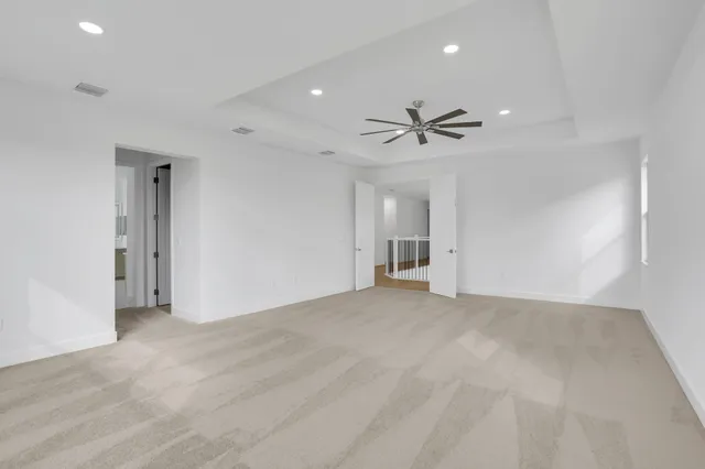 a bathroom with a granite countertop sink and a bathtub