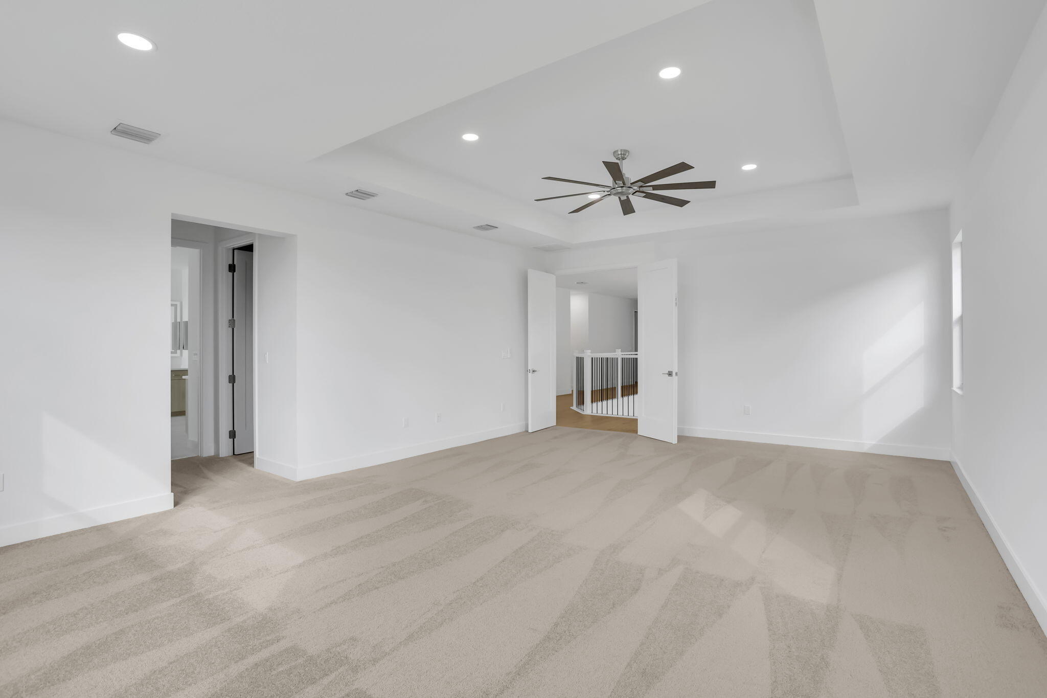 21049 Violet Flds Way Boca Raton, FL 33434 - Photo 30 of 54 a view of an empty room with a ceiling fan