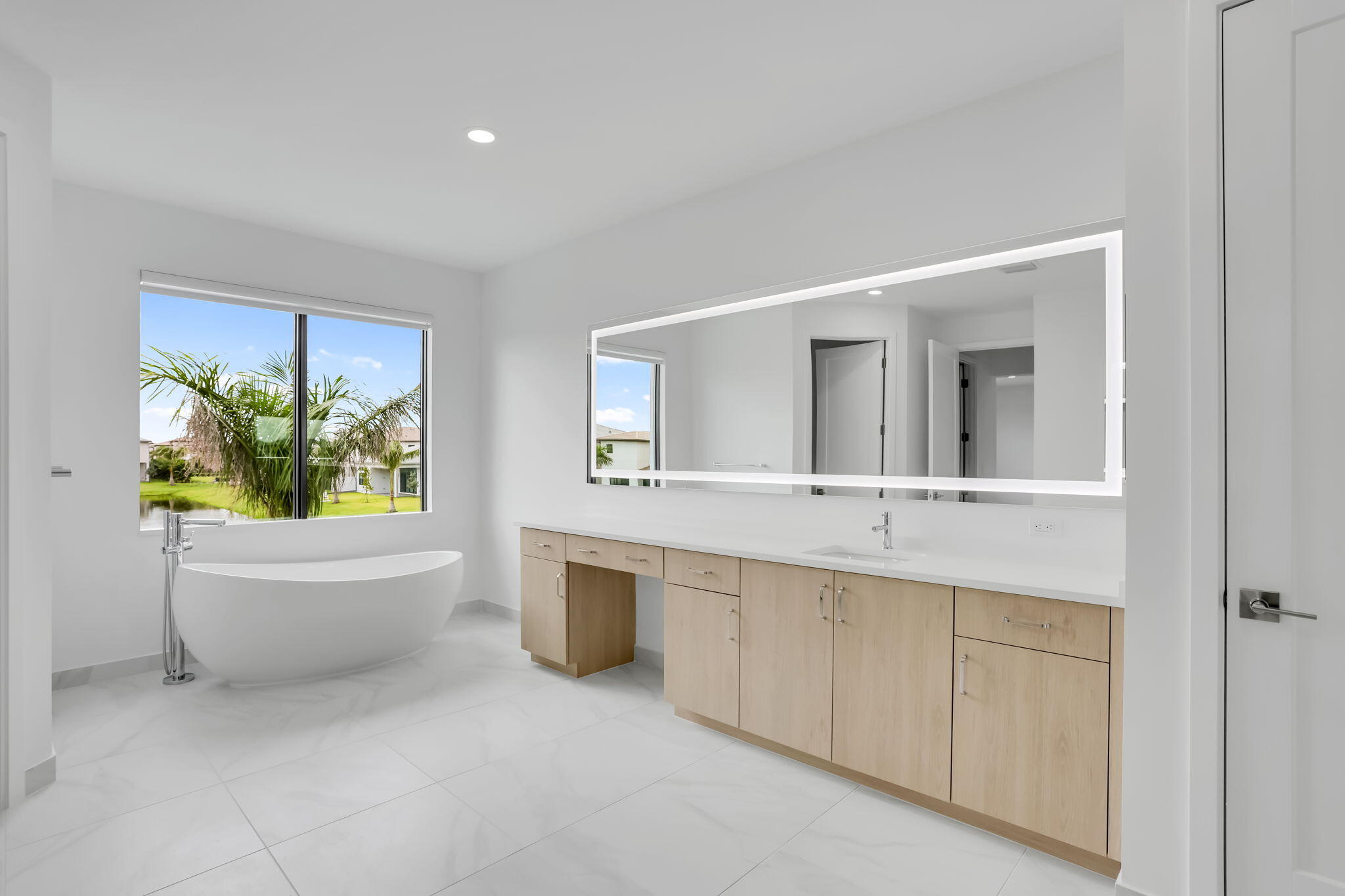21049 Violet Flds Way Boca Raton, FL 33434 - Photo 31 of 54 a bathroom with a granite countertop sink and a bathtub