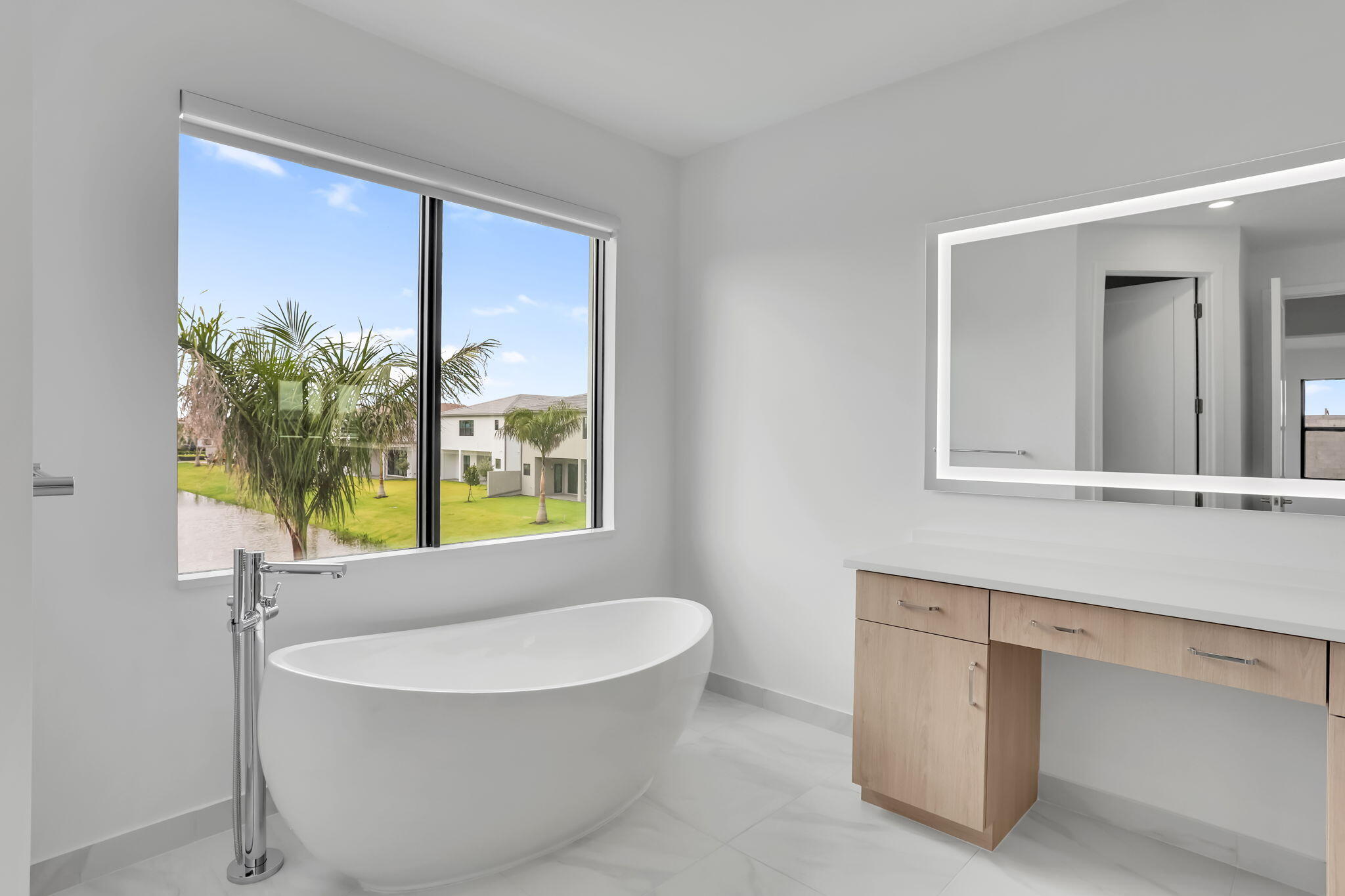 21049 Violet Flds Way Boca Raton, FL 33434 - Photo 33 of 54 a living room with a large window and chandelier