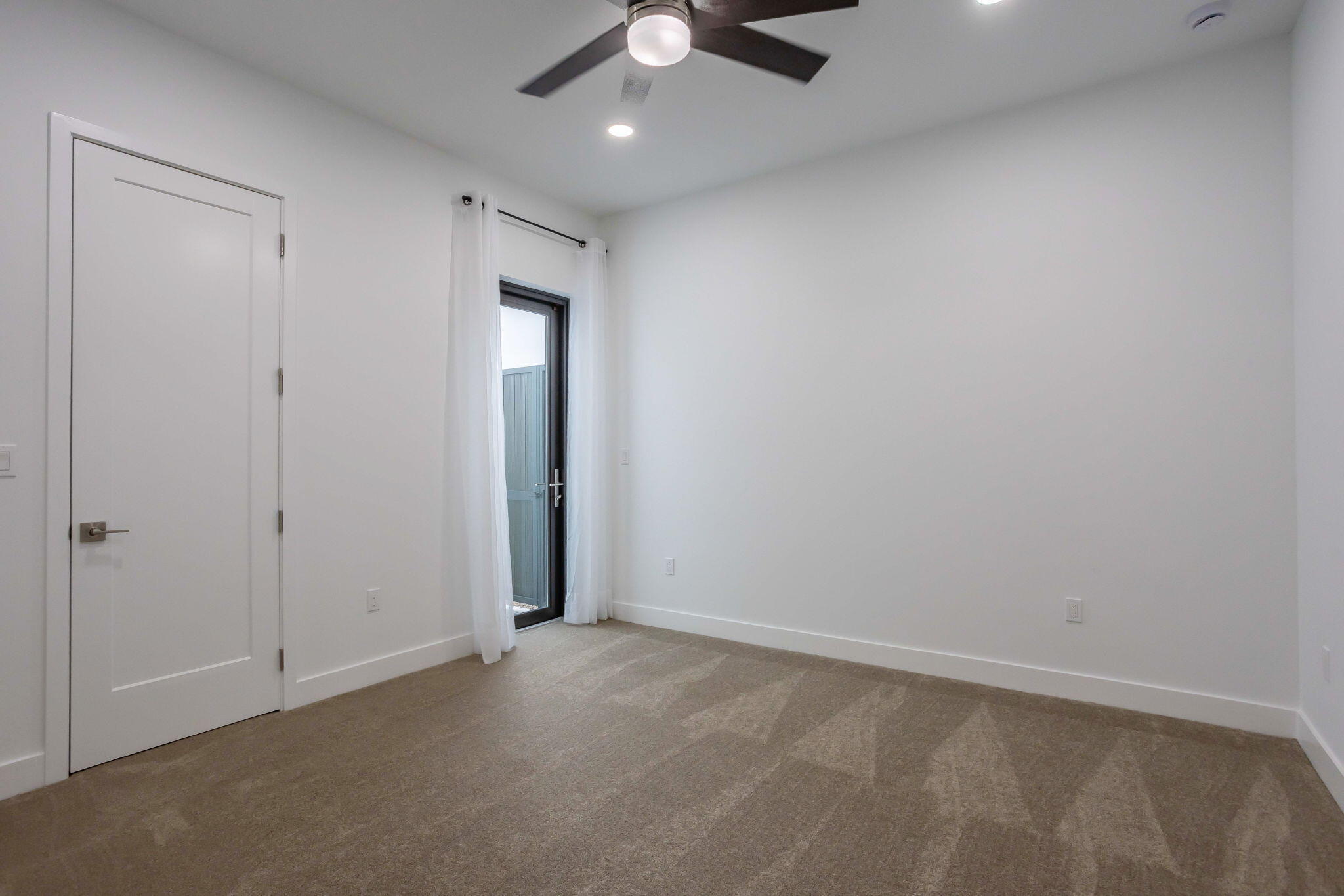 21049 Violet Flds Way Boca Raton, FL 33434 - Photo 36 of 54 an empty room with a ceiling fan and carpet
