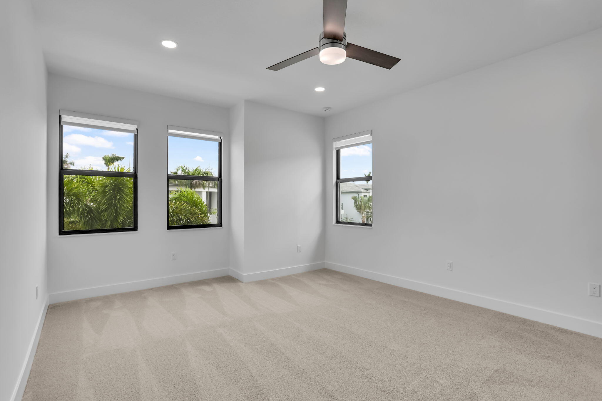 21049 Violet Flds Way Boca Raton, FL 33434 - Photo 39 of 54 an empty room with windows and ceiling fan