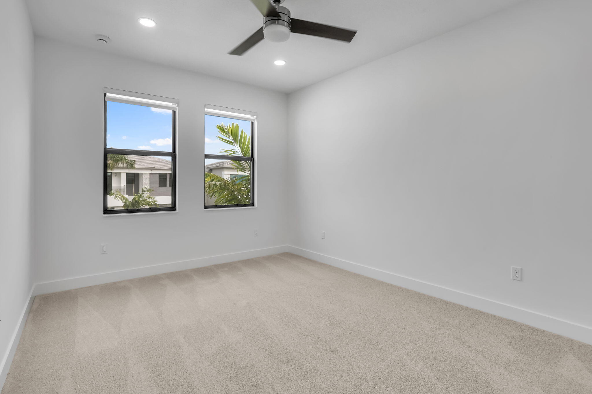 21049 Violet Flds Way Boca Raton, FL 33434 - Photo 40 of 54 an empty room with a window and ceiling fan