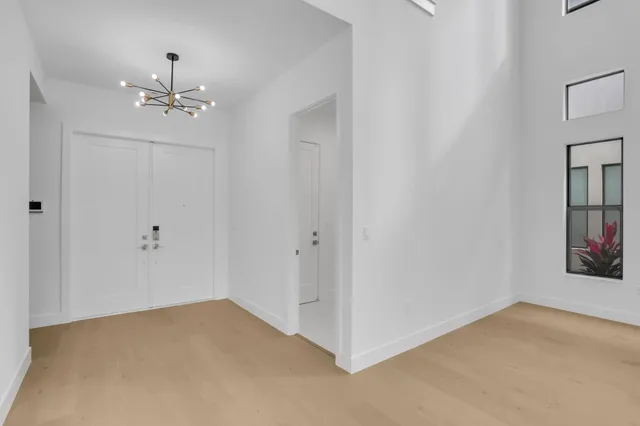 a view of a brick house with potted plants