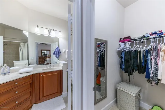 a bathroom with a sink double vanity and a mirror