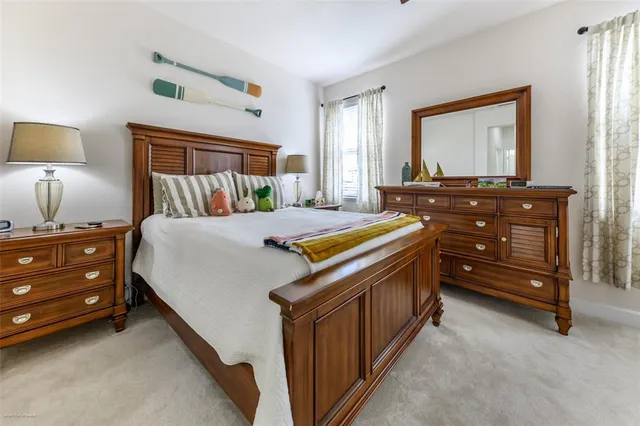 a living room with furniture a air conditioner and a window