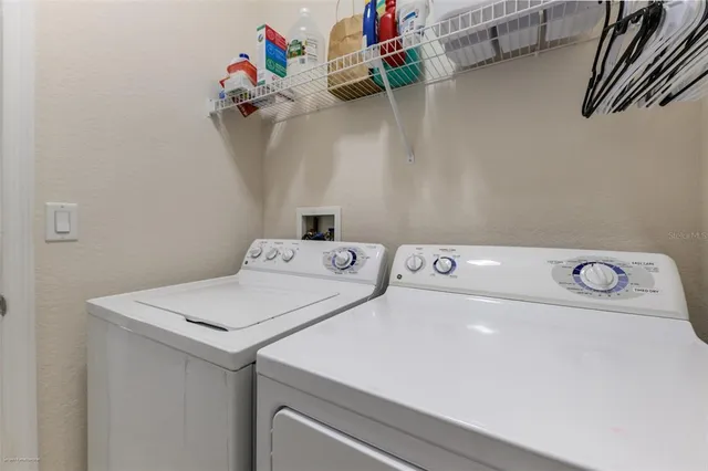 a hallway with furniture and a mirror