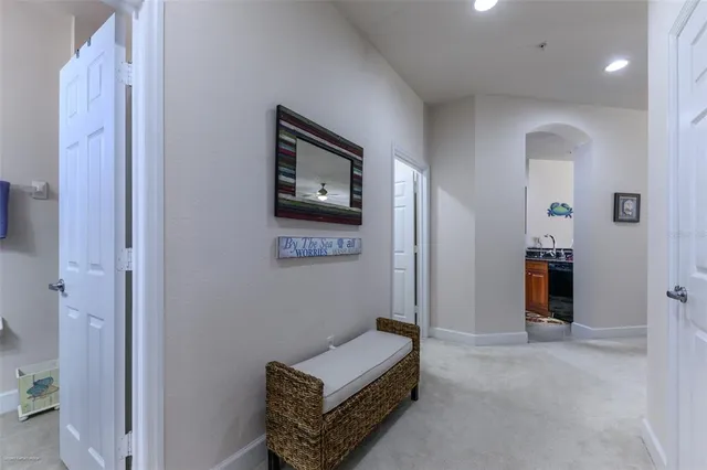 a bathroom with a granite countertop sink mirror vanity and toilet
