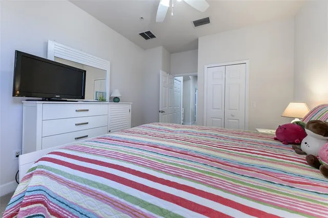 a balcony with furniture and a potted plant