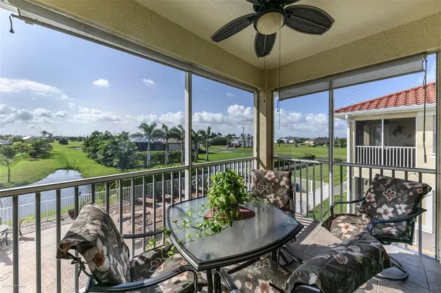 a balcony with table and chairs