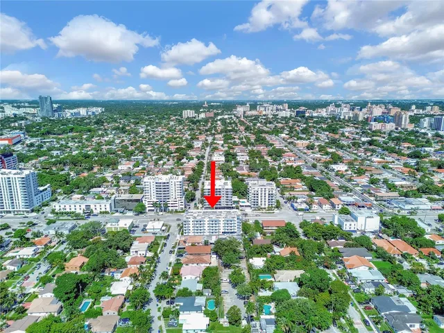 a view of an empty room and wooden floor