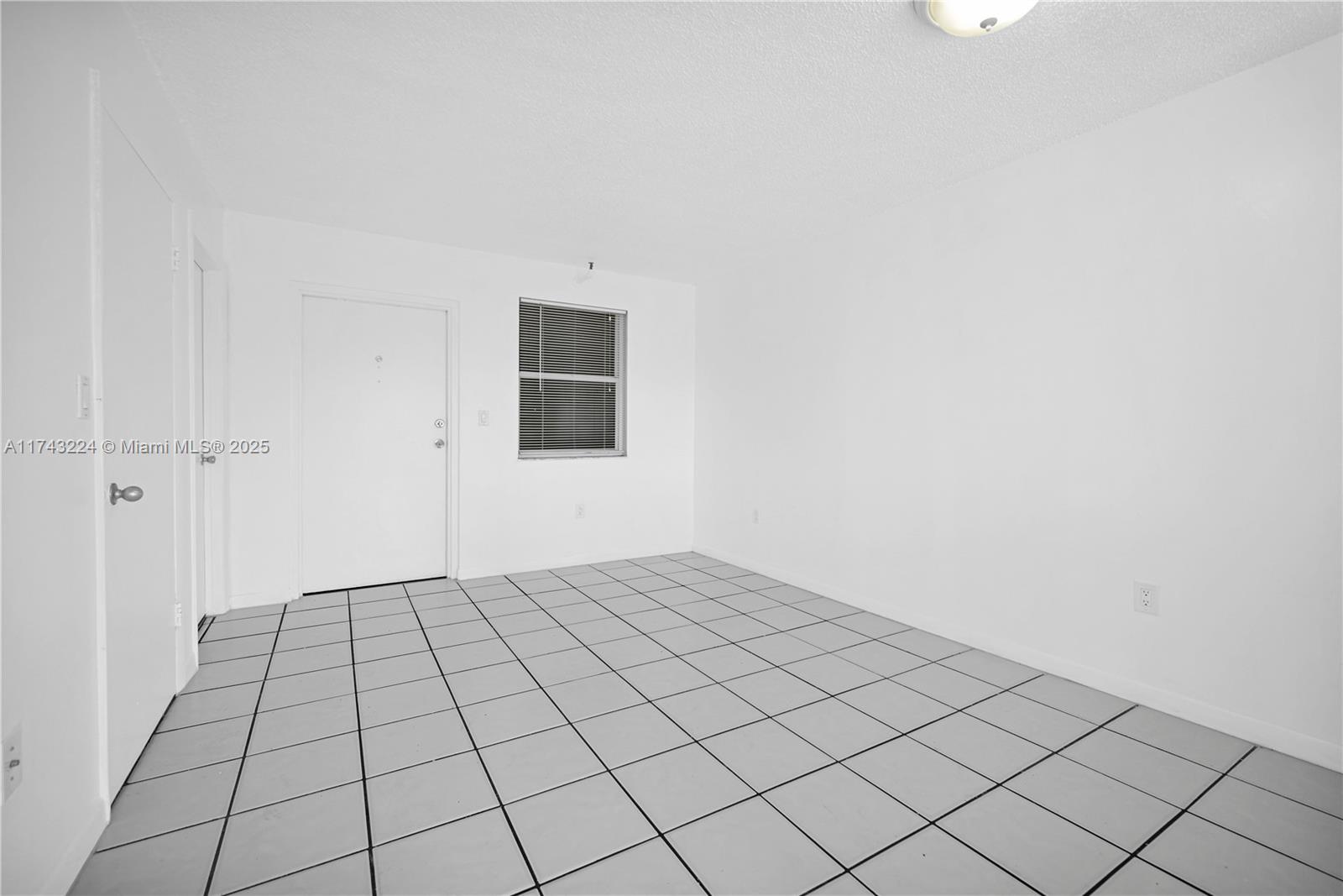 2575 Southwest 27th Avenue, Unit 508 Miami, FL 33133 - Photo 5 of 15 a view of an empty room and wooden floor