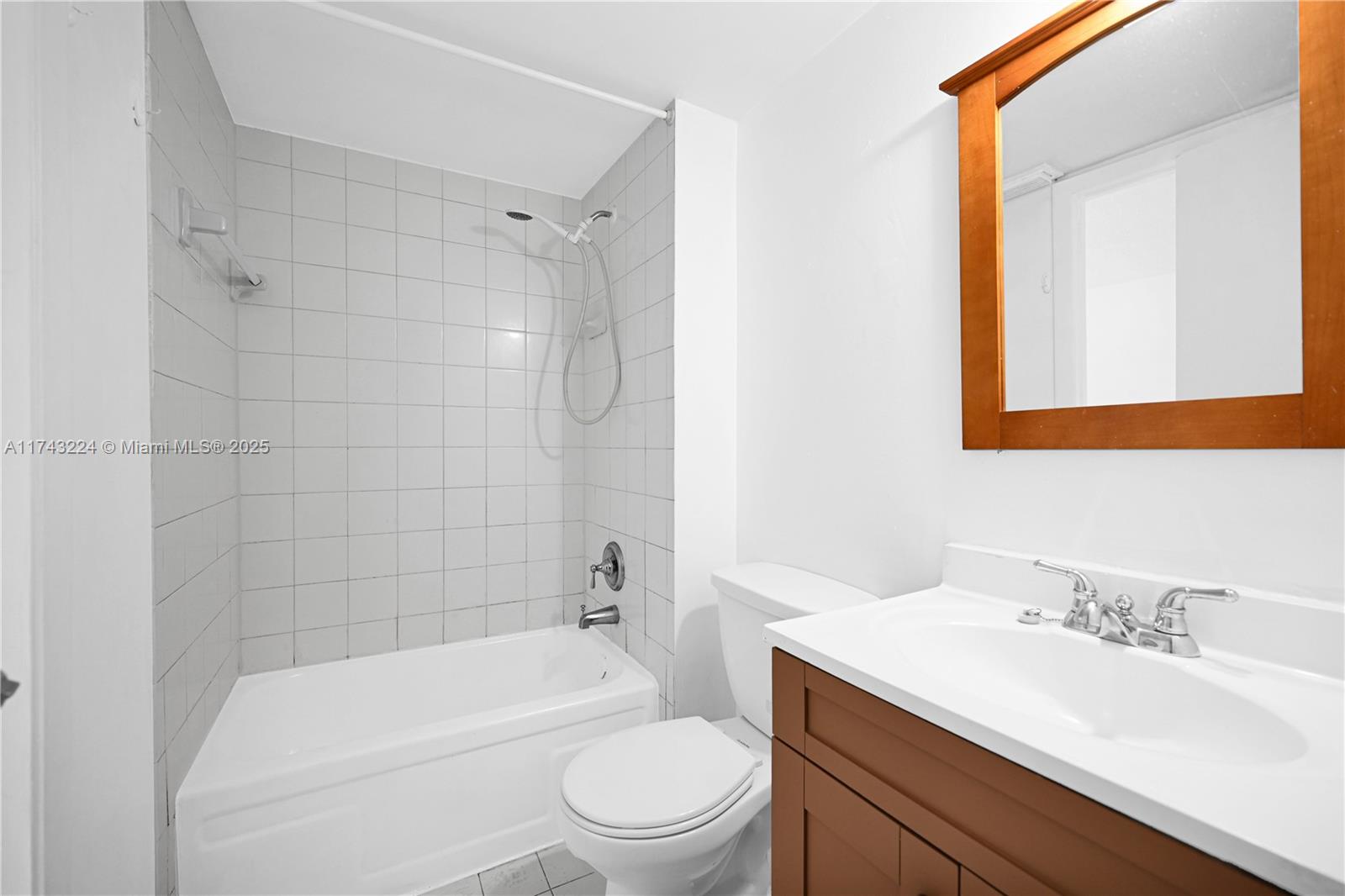 2575 Southwest 27th Avenue, Unit 508 Miami, FL 33133 - Photo 10 of 15 a bathroom with a sink a toilet and shower