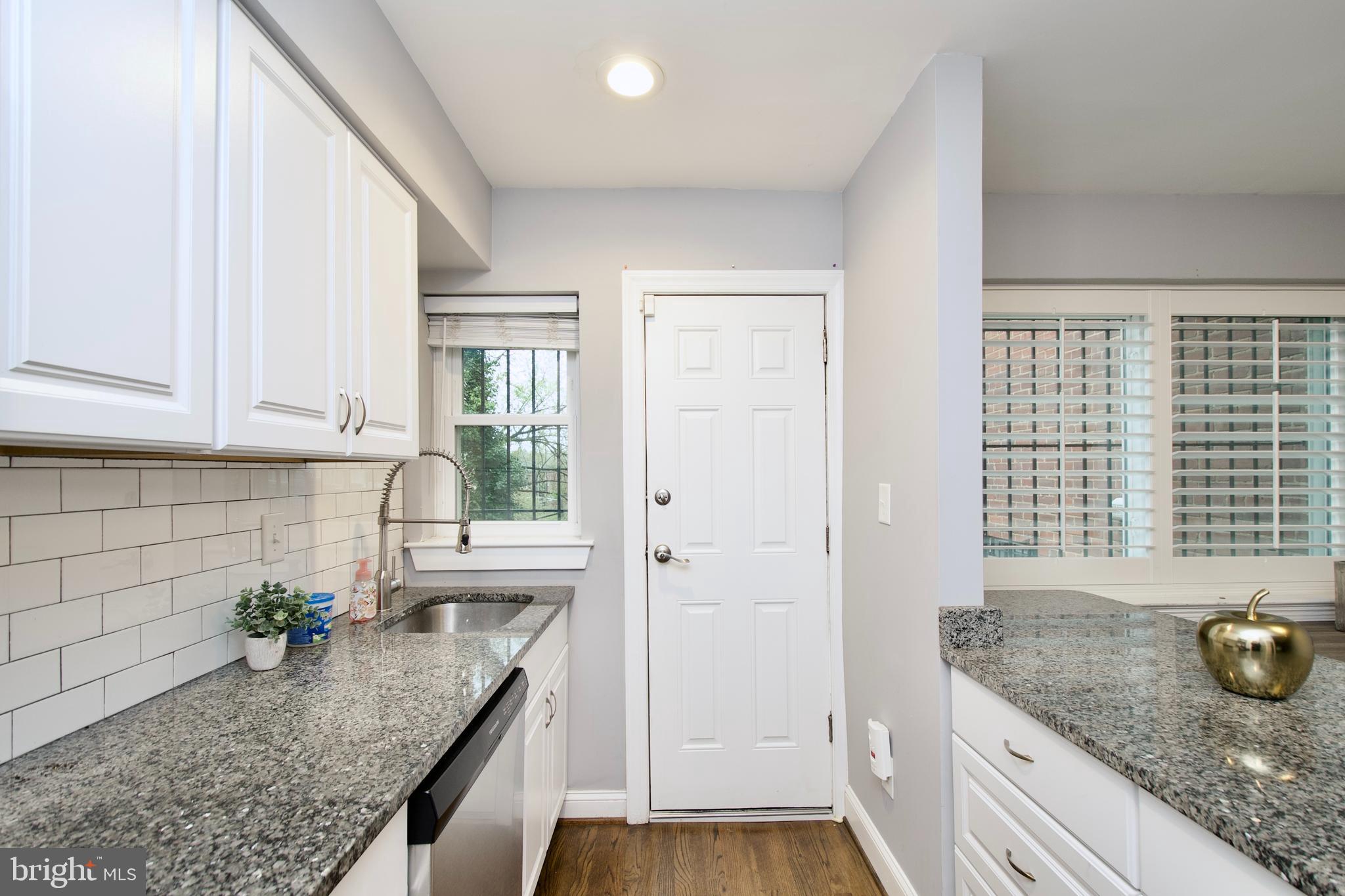 1365 Talbert Terrace Southeast Washington, DC 20020 - Photo 12 of 29 a kitchen with granite countertop kitchen island sink stove and granite counter top
