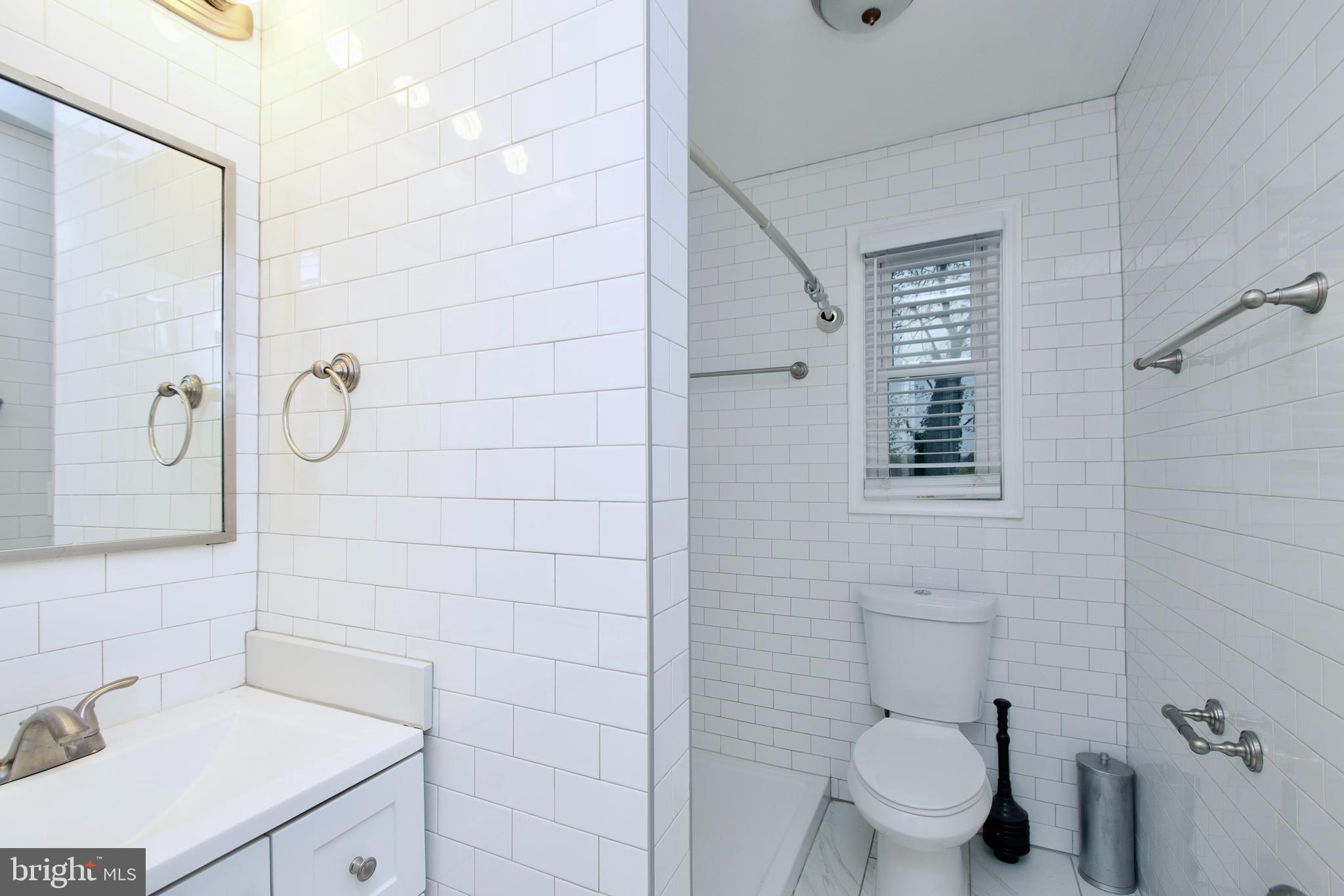 1365 Talbert Terrace Southeast Washington, DC 20020 - Photo 14 of 29 a bathroom with a sink a toilet and shower