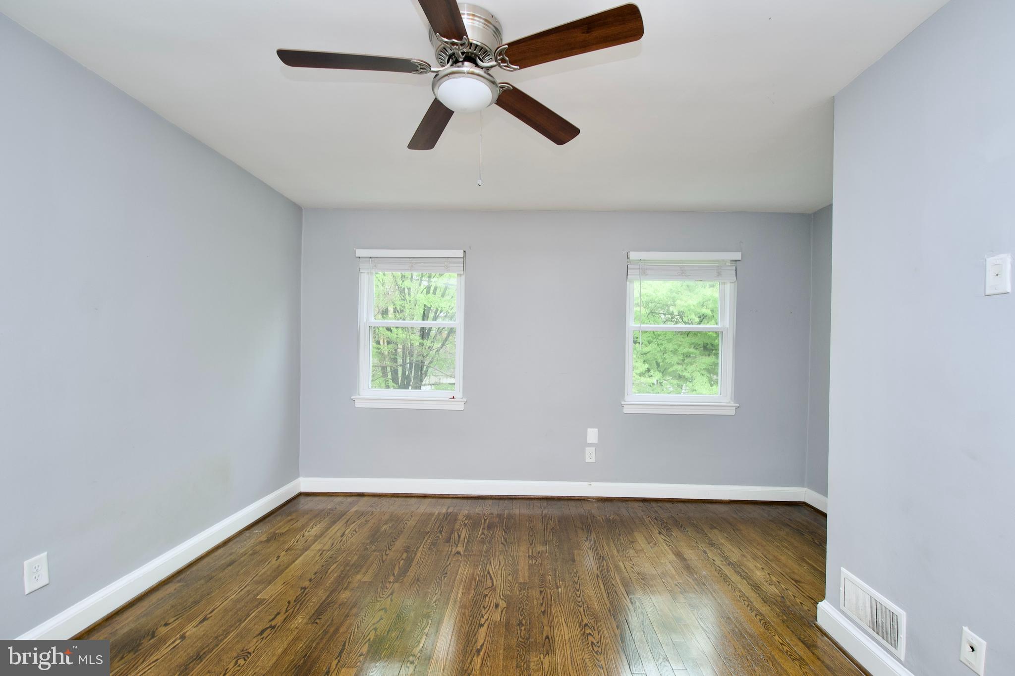 1365 Talbert Terrace Southeast Washington, DC 20020 - Photo 15 of 29 an empty room with wooden floor fan and windows