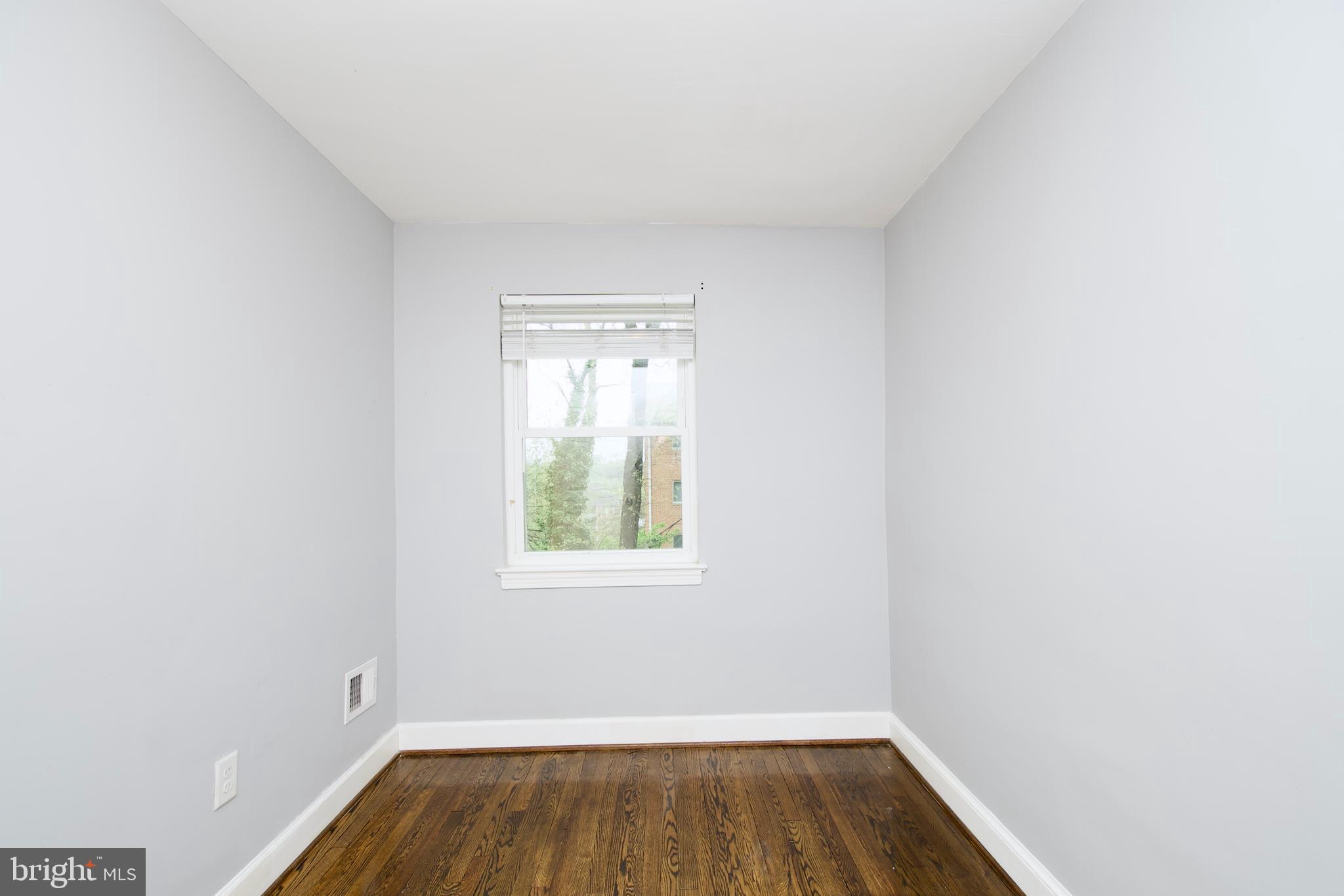 1365 Talbert Terrace Southeast Washington, DC 20020 - Photo 18 of 29 a view of room with window and hardwood floor