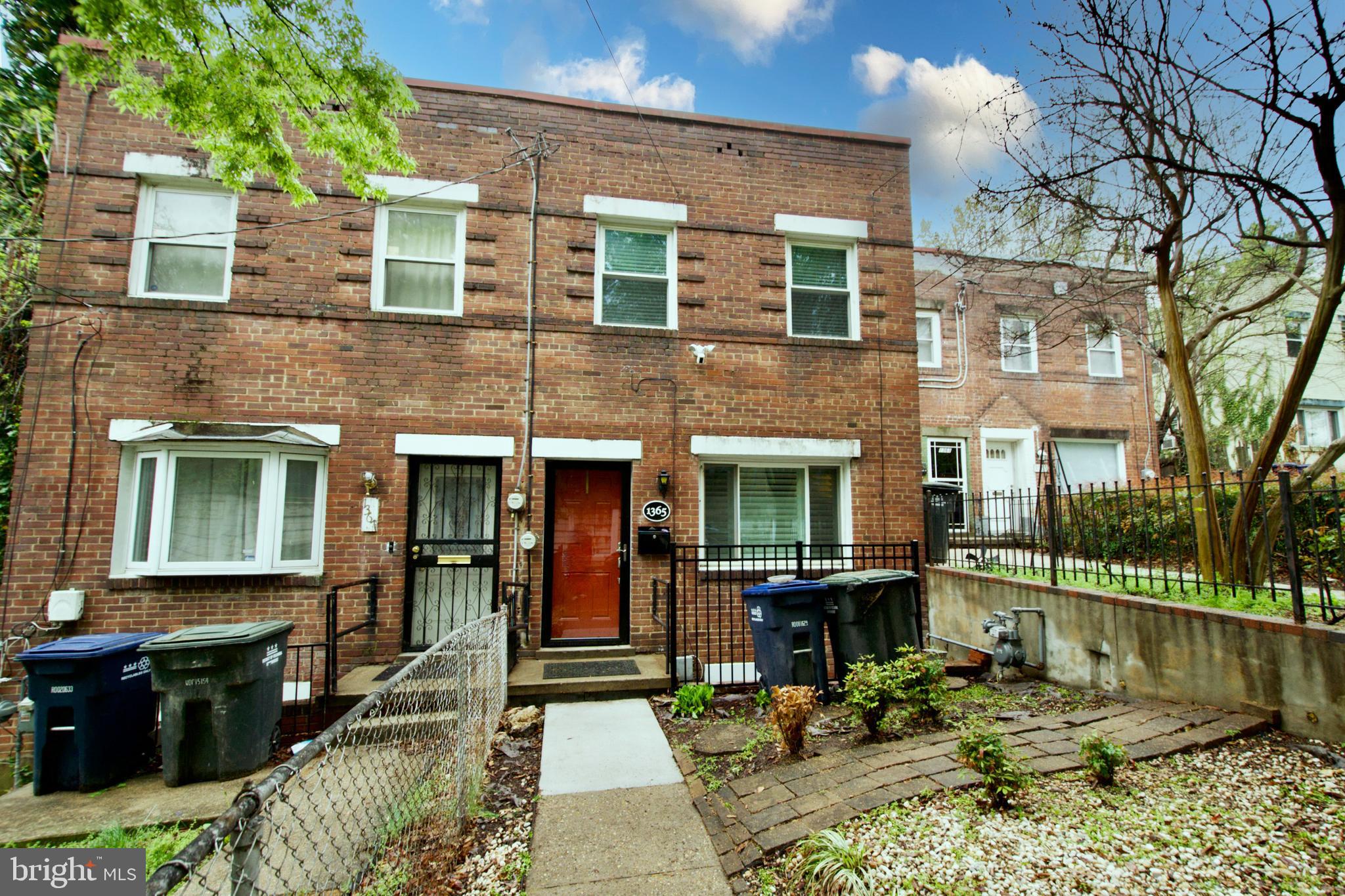 1365 Talbert Terrace Southeast Washington, DC 20020 - Photo 5 of 29 a front view of a house with a yard
