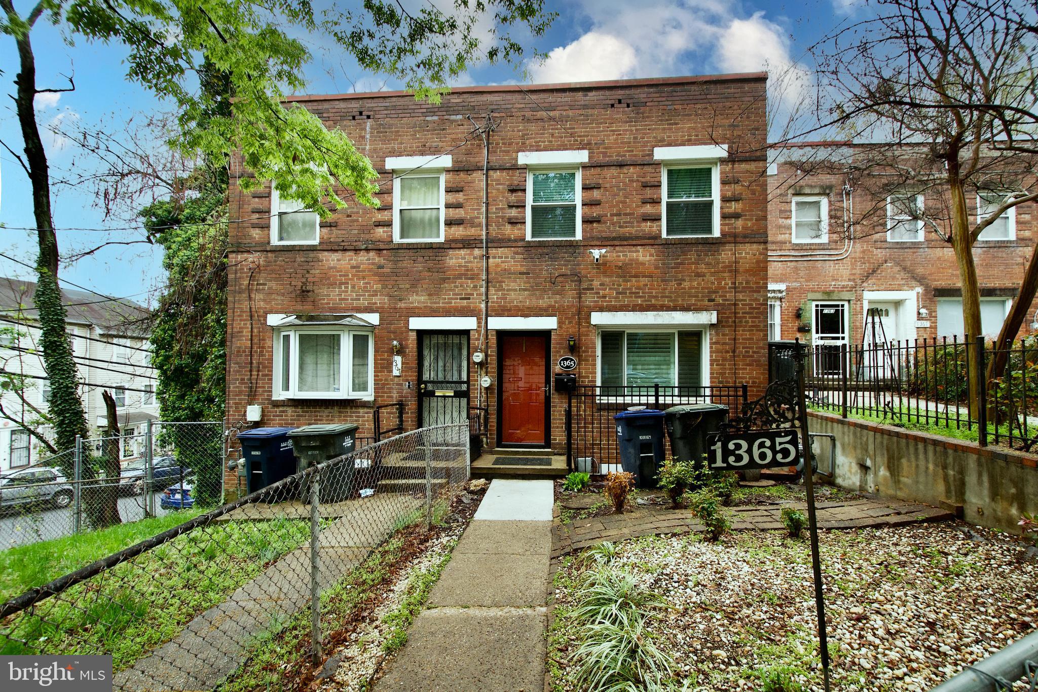 1365 Talbert Terrace Southeast Washington, DC 20020 - Photo 6 of 29 a front view of a house with garden