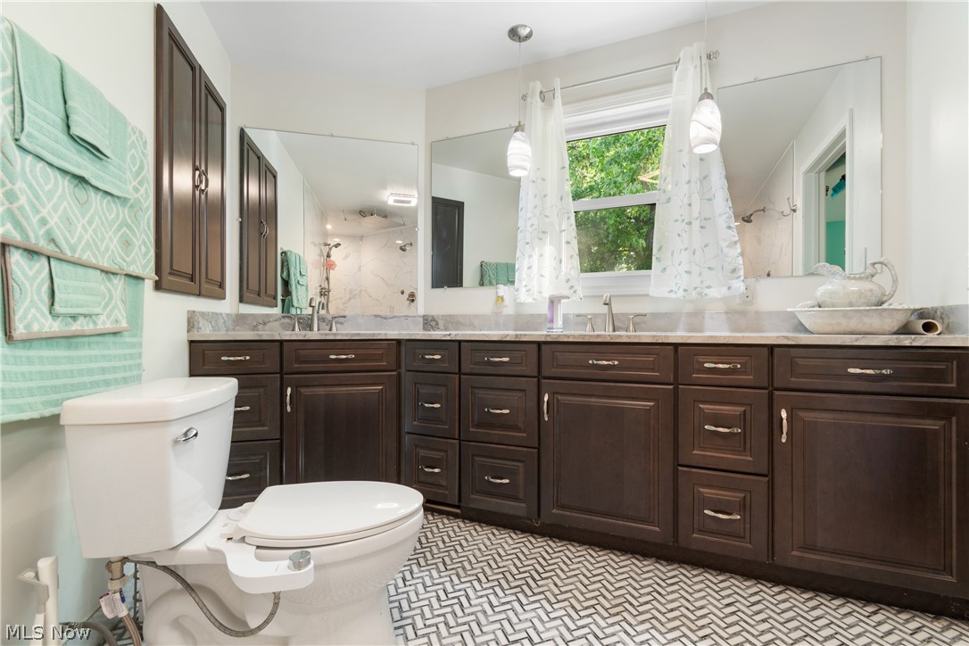 3255 Old Weymouth Road Medina, OH 44256 - Photo 17 of 31 Bathroom with tile flooring, toilet, and dual bowl vanity