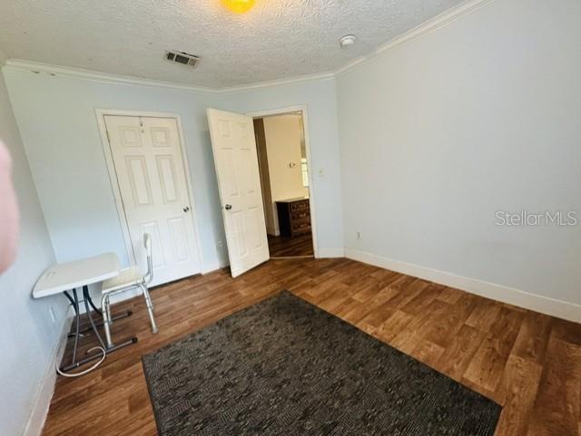 11817 Southwest 58th Street Webster, FL 33597 - Photo 20 of 46 a view of empty room with wooden floor