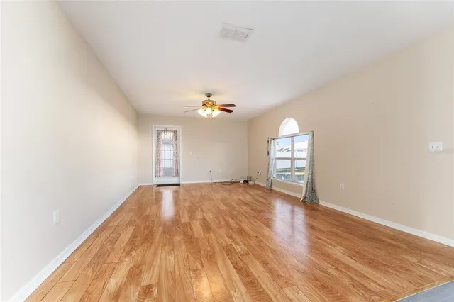 a kitchen with stainless steel appliances granite countertop a sink a refrigerator and a stove top oven