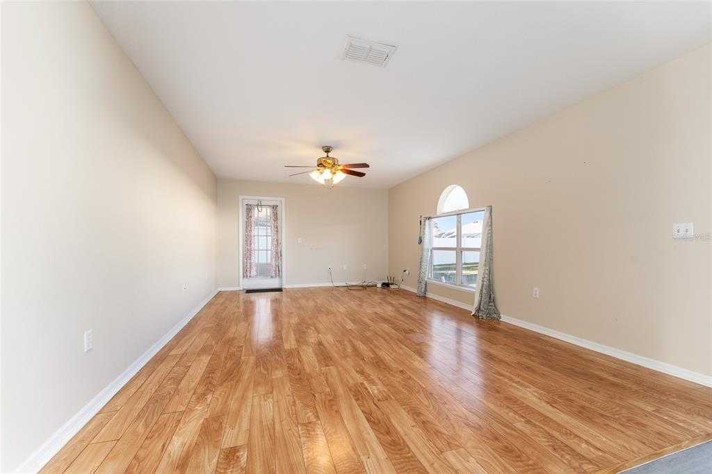 2661 Northeast 42nd Road Ocala, FL 34470 - Photo 19 of 74 wooden floor in an empty room with a window