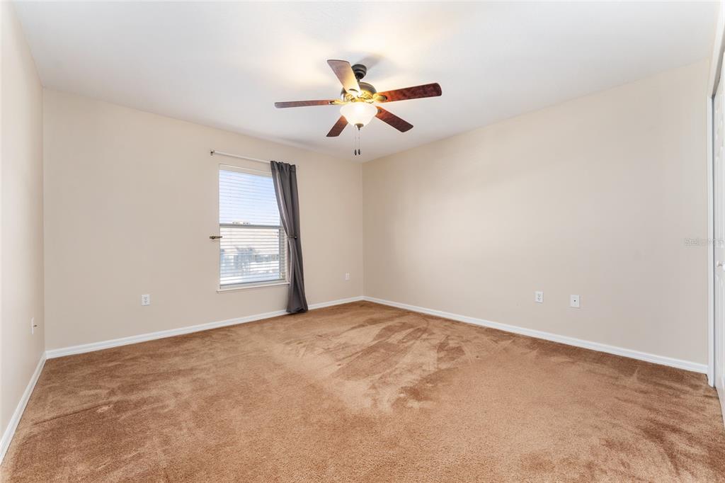 2661 Northeast 42nd Road Ocala, FL 34470 - Photo 35 of 74 an empty room with windows and fan