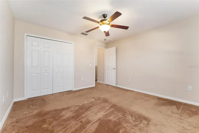 a spacious bathroom with a bathtub sink and mirror