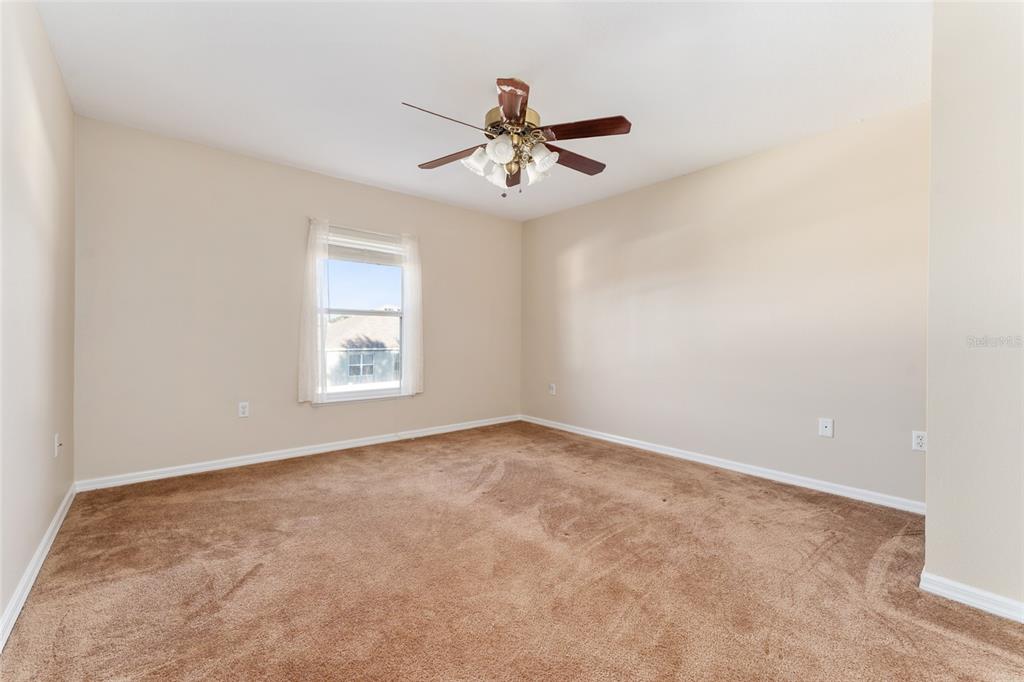 2661 Northeast 42nd Road Ocala, FL 34470 - Photo 37 of 74 an empty room with windows and fan