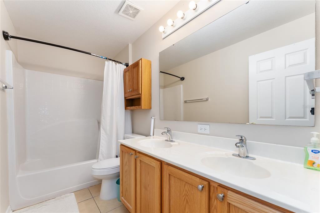 2661 Northeast 42nd Road Ocala, FL 34470 - Photo 42 of 74 a bathroom with a sink and a mirror