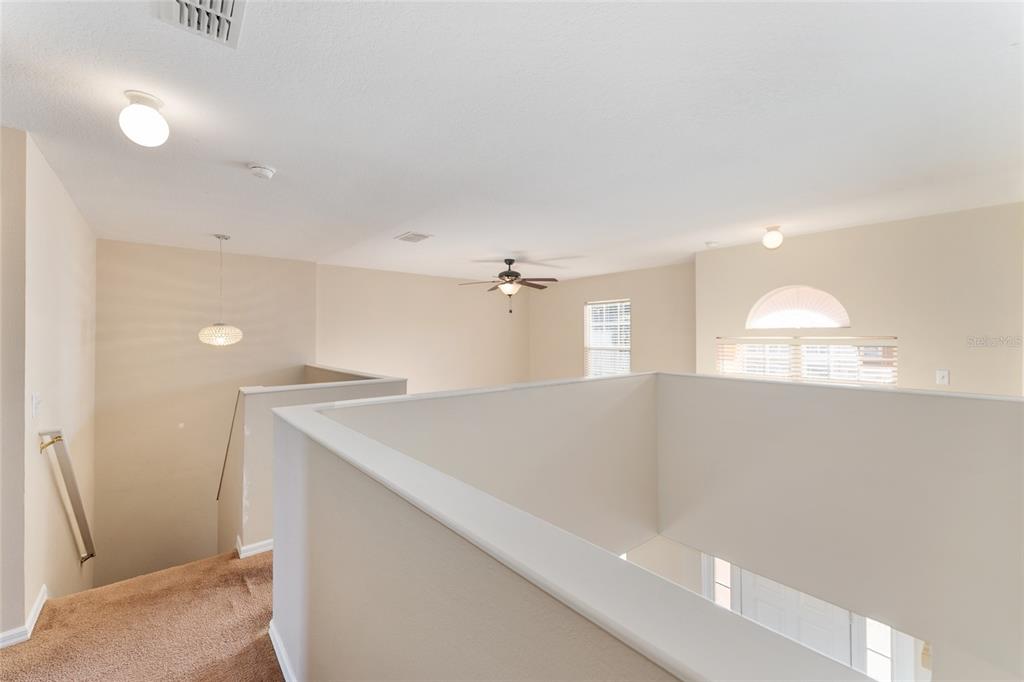 2661 Northeast 42nd Road Ocala, FL 34470 - Photo 44 of 74 a view of a room with a ceiling fan and wooden floor
